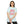 Person wearing a light blue t-shirt with 'Saved by Grace' text and floral design on a white background