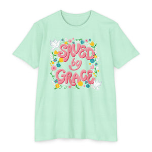 Mint green t-shirt with 'Saved by Grace' text and floral design on a white background